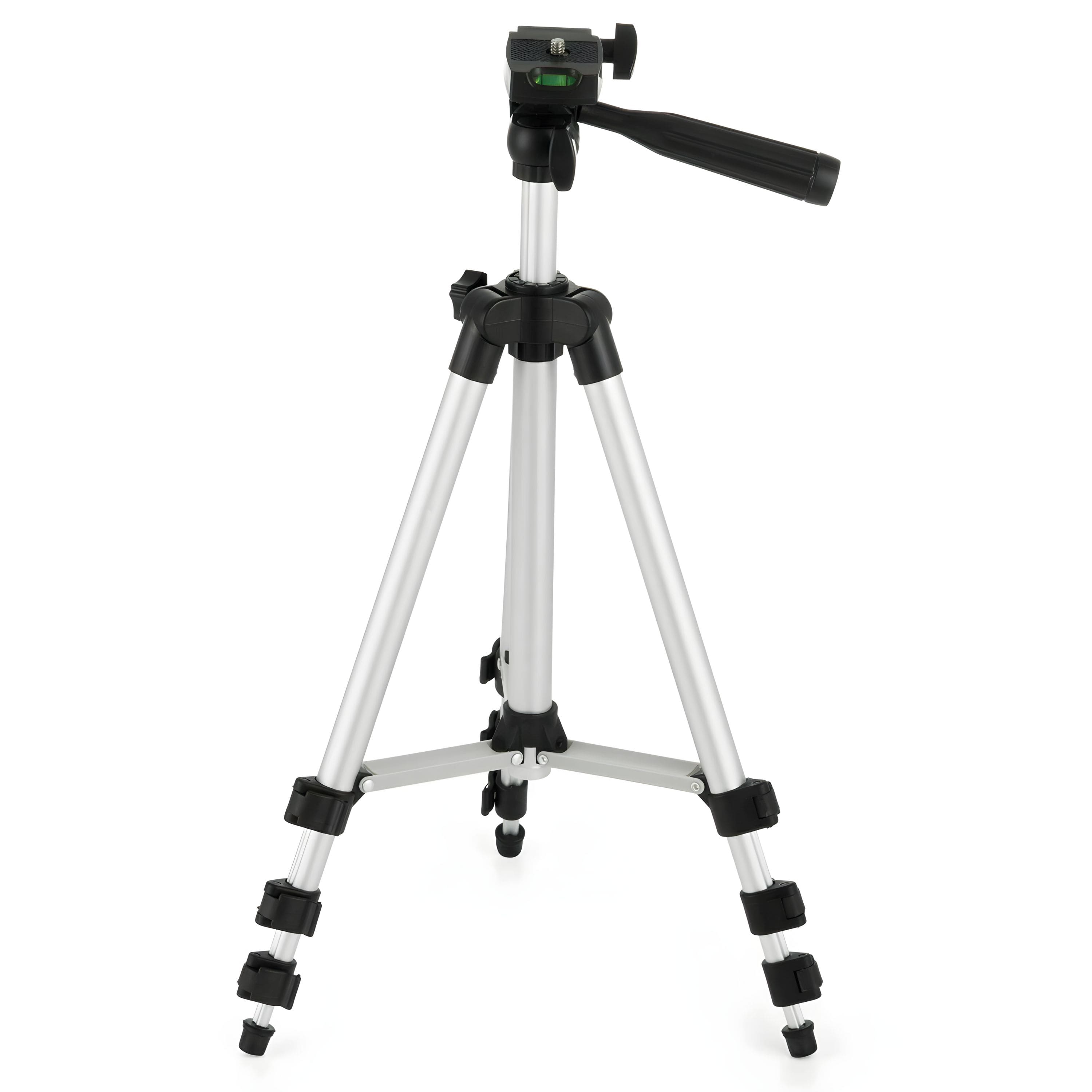 'Travel tripod set up on rocky terrain with camera attached'